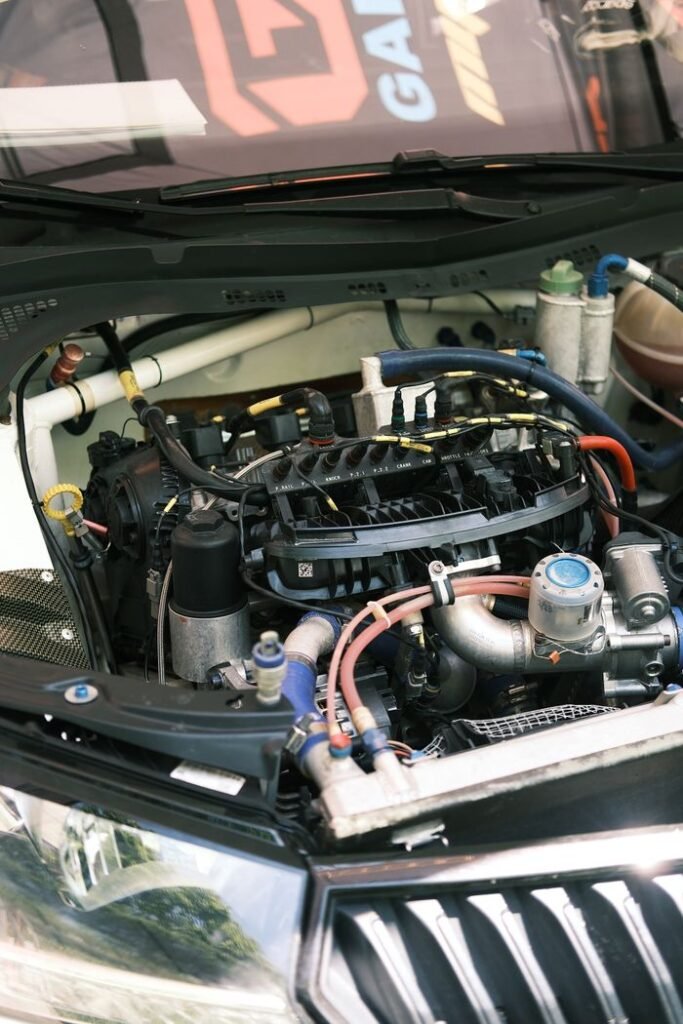 Close-up view of a car engine bay showcasing various components in detail.