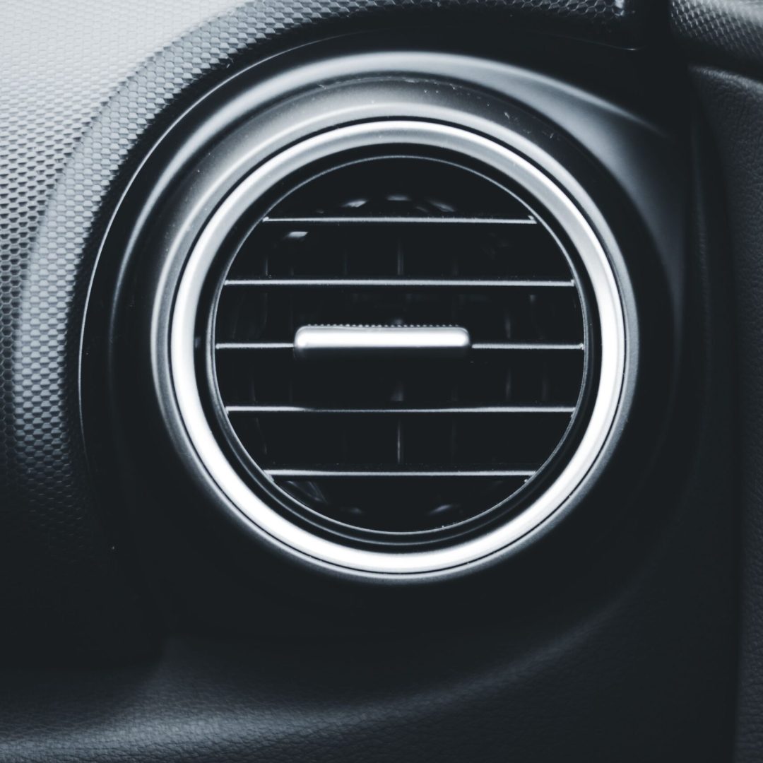 Detailed close-up of a car air vent highlighting modern vehicle interior design.
