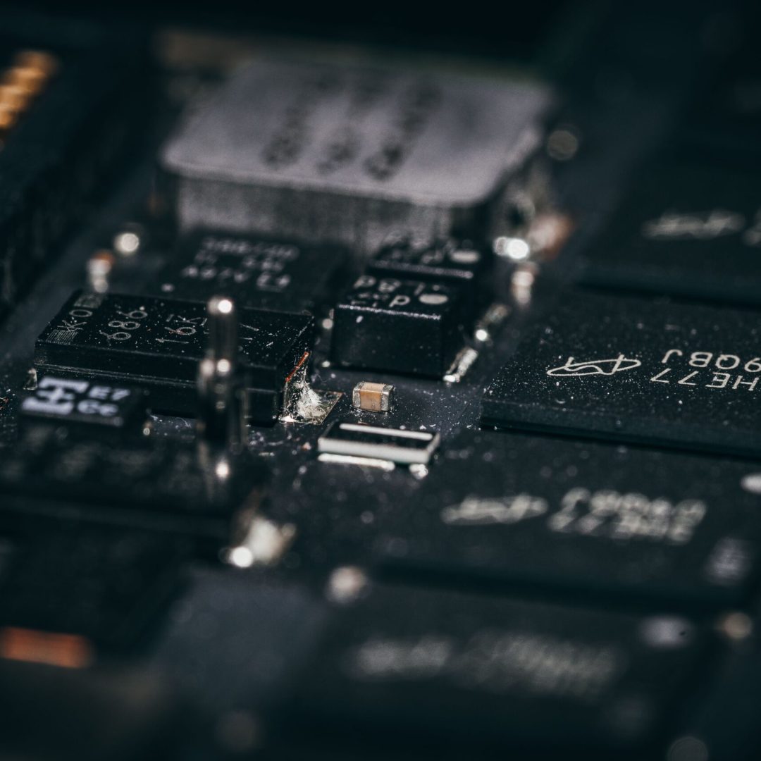 Detailed macro shot of electronic circuit components showcasing intricate design and layout.